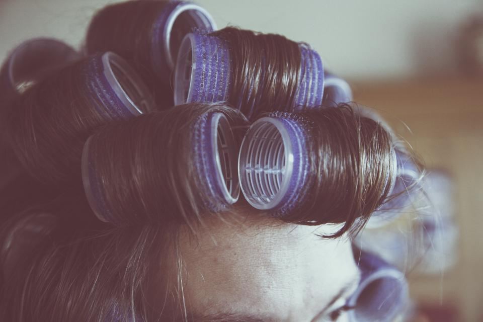 Hair set in rollers, softly lit